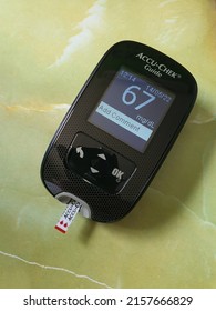 BANGKOK THAILAND - MAY 14: Electronic Blood Sugar Monitor Show Low Blood Sugar Levels.  Knowing Your Blood Sugar Levels Helps You Manage Your Diabetes And Reduces Risk Of Having Serious complications.