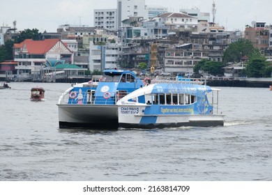 BANGKOK, THAILAND - MAY 17, 2022: Tourist boat on the Chao Phraya River on May 17, 2022 in Thai capital Bangkok