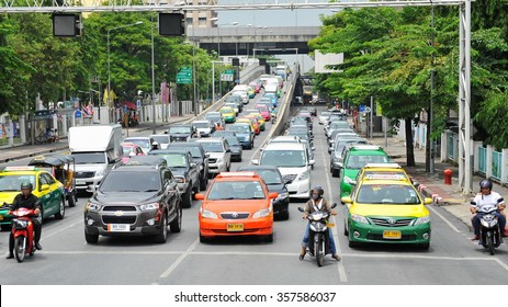 BANGKOK, THAILAND - MAY 18, 2013: Traffic nears gridlock on a busy road in the city center. Annually an estimated 150,000 new cars join the heavily congested roads of the Thai capital.