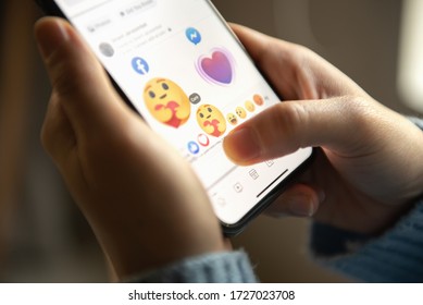 Bangkok, Thailand - May 2, 2020 : Facebook User Touch On Care Emoji Button In Facebook Application On IPhone 11.