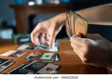 Bangkok, Thailand - May 2, 2021 : A man playing Magic The Gathering card game.