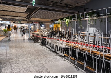 Bangkok, Thailand. May 2, 2021. Empty restaurants food outlet shop removed seating area after Thai government restrict eat in customer for 14 days during third wave of Covid-19 outbreak in Bangkok.