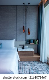 BANGKOK, THAILAND - MAY 20, 2022 : Beautiful Hanging Wooden Bedside Lamps In Bangkok Luxury Hotel