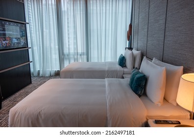 BANGKOK, THAILAND - MAY 20, 2022 : Two Twin Beds In A Luxury Hotel Room In Bangkok 