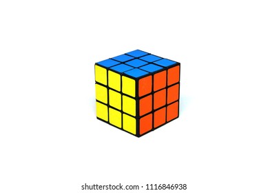 BANGKOK THAILAND -May 27 2018 : Rubik's Cube Puzzle Is Take A Photo On  White Studio Background.It Is Blue , Yellow And Orange Color