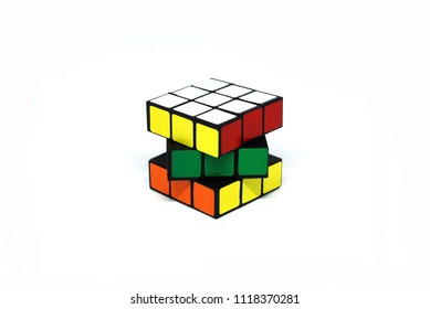 BANGKOK THAILAND -May 27 2018 : Rubik's Cube Puzzle Is Take A Photo On  White Studio Background.It Is White , Yellow And Red Color