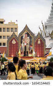 BANGKOK, THAILAND, MAY 4, 2019: Thai People Watch A Picture During The Coronation Of His Majesty King Maha Vajiralongkorn Bodindradebayavarangkun (King Rama X), Bangkok, Thailand