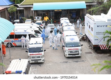 Bangkok, Thailand - May 8, 2021 Ambulance With Volunteers Dressed In PPE Clothes Ready To Bring Covid-19 Infected People From Wat Saphan Klong Toey To Hospital. To Heal In The Public Health System.