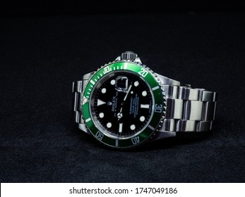 Bangkok ,Thailand - May 9 2020 : Rolex Green Submariner 50th Anniversary Model 16610v With Green Film Bezel On Black Background Isolated.