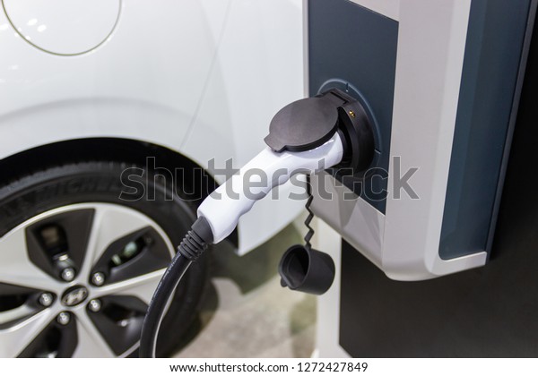 Bangkok\
Thailand :- Nov 30, 2018:- the charging the battery for the car new\
Automotive Innovations the power supply plugged into an electric\
car being charged, concept of energy\
innovation.