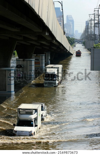 Bangkok, Thailand - November 07 2011: Road\
totally flooded in the Lad prao district. It was the worst to date\
flood in Thailand, lasting 175 and costing 46.5 billion dollars in\
property damages.
