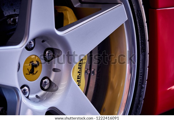 BANGKOK, THAILAND - NOVEMBER 1, 2018: Ferrari F430
rims and ceramic break. Close up of wheel with a logo and yellow
caliper of carbon ceramic breaking system. High performance brake
rotor and disc.