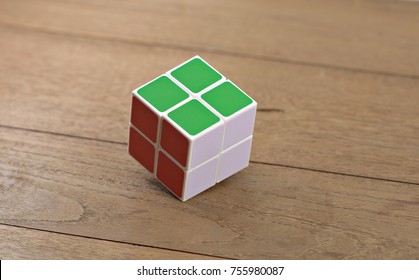 Bangkok, Thailand - November 10, 2017: Rubik's cube 2x2 on a wooden table. Rubik's Cube invented by a Hungarian architect Erno Rubik in 1974.