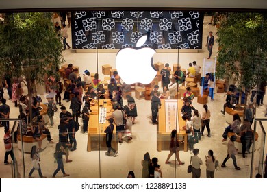 Bangkok, Thailand - November 10 2018: Many People Is View Products (iPhone, IPad, IMac, MacBook, Apple Watch, AirPods) In Apple Iconsiam Or Apple Store Thailand On The First Day. Night Time.