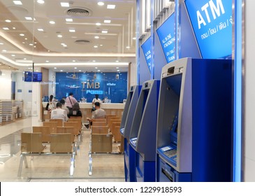 Bangkok /Thailand - November 13, 2018 : Thai TMB Retail Banking Customer Service, Comparing The Human Service At Branch Counter Inside The Bank Versus Automatic Self Service Outside.