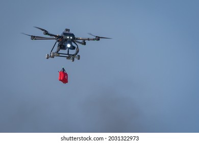 Bangkok, Thailand - November 18, 2019 : Rescue Drone Flying With Carrying First Aid Kit Package On Blue Sky At Defense And Security 2019 Thailand. Emergency Medical Care Concept.