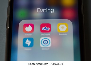 Bangkok, Thailand - November 19, 2017: Dating applications display on iPhone 6 including Tinder