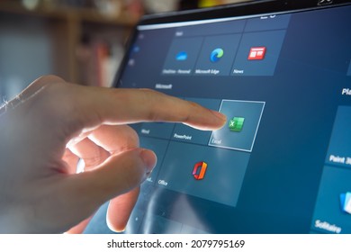 Bangkok, Thailand - November 20, 2021 : Computer user touching on Microsoft Excel icon to open the software.
