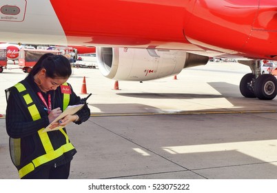 BANGKOK Thailand.- November 28 2016: Porter Airlines, Air Asia check the engine before takeoff at the airport Bangkok Thailand.