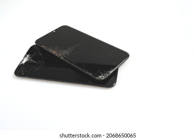 Bangkok, Thailand, November 3, 2021. Image Of An IPhone With A Cracked Display Awaiting Repair, Revealing All Data On A White Background.