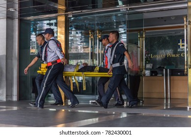 Bangkok, Thailand - November 30, 2017 : Many Working People Preparedness For Fire Drill Or Other Disaster By Move Injury Patient On Spine Board At Office In Bangkok Thailand