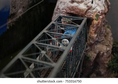 Bangkok, Thailand - November 4, 2017 : A Photo Of Thomas The Tank Engine Model Toy Coming Through The Steel Bridge. Thomas Is A Fictional Steam Locomotive Series Book By Wilbert Awdry And Christopher.