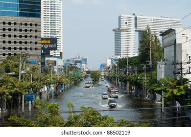 BANGKOK, THAILAND - NOVEMBER 6: Various vehicles navigate through the flood on Phahonyothin Road during the worst flooding in Bangkok, Thailand on November 6, 2011.