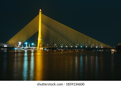 Bangkok, Thailand - November 7 2020: Nighttime at The Rama VIII or 8 Bridge is a cable-stayed bridge crossing the Chao Phraya River in Bangkok, Thailand. Asia.