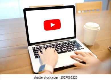 Bangkok. Thailand. Obtober 7,2019,Young Woman Using Laptop With YouTube Logo In The Screen Seeting At The Office Desk. A Girl In Office Watching You Tube.