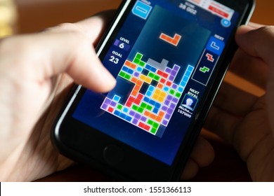 Bangkok, Thailand - October 11, 2019 : Smartphone User Playing Tetris Game On Iphone 7.