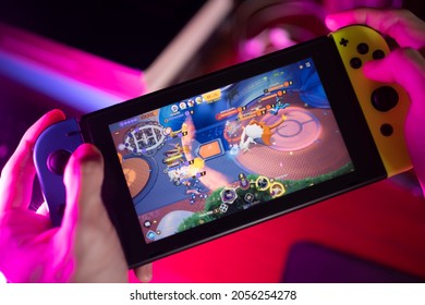 Bangkok, Thailand - October 12, 2021 : A Gamer Playing Pokémon Unite On Nintendo Switch.