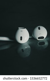 BANGKOK, THAILAND - OCTOBER 16, 2019: Apple Earphones Shot At My Studio With A Blue Gel Lighting