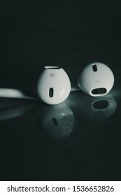 BANGKOK, THAILAND - OCTOBER 16, 2019: Apple Earphones Shot At My Studio With A Blue Gel Lighting