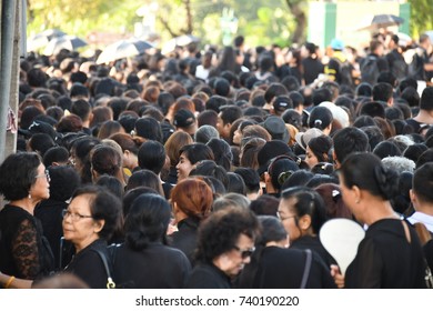 BANGKOK, THAILAND - OCTOBER 21,2017: Crowd of Thai people in black mourning cloth going to Sanam Luang Ceremonial Ground for watching the processions of honour in The Royal Cremation Ceremony, Bangkok