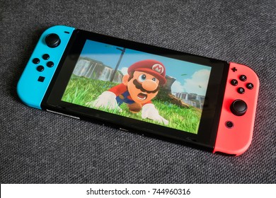 Bangkok, Thailand - October 28, 2017 : Nintendo Switch showing its screen with Super Mario Odyssey game.