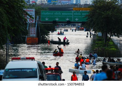 BANGKOK, THAILAND - OCTOBER 30: Unidentified victims use a boat to transport in Thai flood crisis on October 30,2011 Bangkok, Thailand.