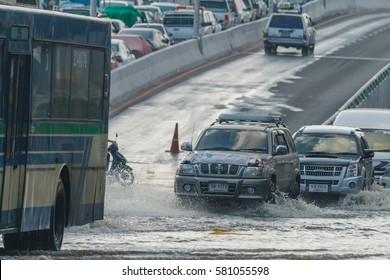 BANGKOK, THAILAND - OCTOBER 31, 2011 Car Stuck In Mud And Splash, Concept Of Natural Disaster Flood On All Road.