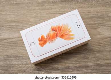 BANGKOK ,THAILAND - OCTOBER 31, 2015 : Unpacking new phone iPhone 6S on wood background. iPhone 6S was created and developed by the Apple inc.