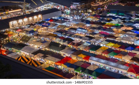 Bangkok, Thailand- On August 12, 2019. Train Night Market at Ratchada Rot Fai is one of the most famous local shopping and eating areas in downtown, colorful illumination, light, walking, food, cloth - Shutterstock ID 1486901555