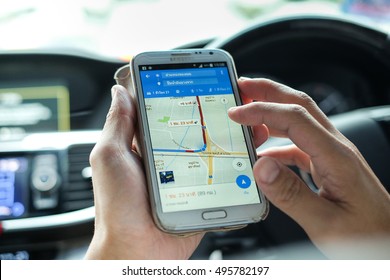BANGKOK, THAILAND - SEP 23, 2016: Man in the car using a Google Maps on Samsung Note 2. Google Maps is a most popular web mapping service for mobile provided by Google inc.(shallow depth of field)