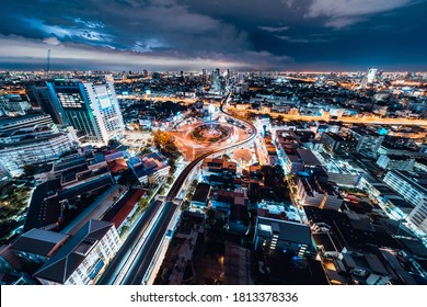 Bangkok, Thailand - Sep 7, 2020: Cityscape View Of Car Traffic Transportation At The Victory Monument Roundabout At Night. Asian City Life, Asia Travel Landmark, Public Transport Concept