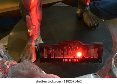 Bangkok, Thailand - September 16, 2018: Human Size Predator Statue Standing With The Standee Of The Movie The Predator Displays At The Theater.