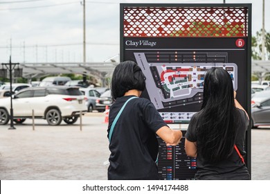 Bangkok, Thailand September 2, 2019. Customers Looking At A ​map Of The Open-air​ Shopping Area Of The Newly Open Premium Outlet Mall Central Village Locates Near Suvarnabhumi Airport.