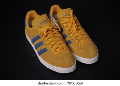 BANGKOK, THAILAND - September 20,2017: Adidas Originals Topanga yellow blue sneakers - illustrative editorial - Shutterstock ID 739035064