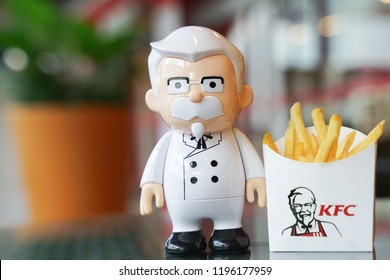BANGKOK ,THAILAND- September 21,2018: Colonel Harland Sanders doll with french fired  in front of KFC restaurant