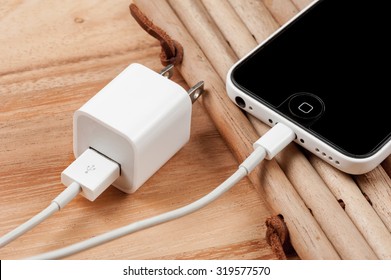 BANGKOK, THAILAND - SEPTEMBER 23, 2015: The IPhone5C Connecting With The Charger Cable.