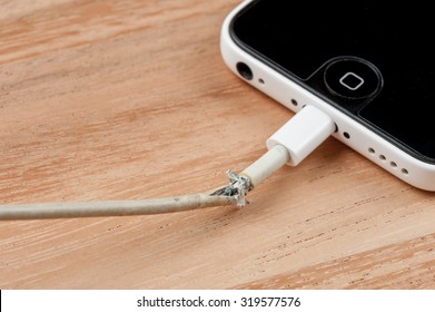 BANGKOK, THAILAND - SEPTEMBER 23, 2015: The Broken IPhone Charger Cable.