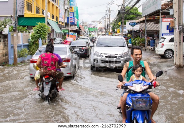 Bangkok, Thailand - September 25, 2016 :\
Water flood in Bangkok city problem with the manhole overflow in\
drainage system it full from garbage when rain\
storm.
