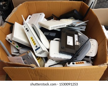 BANGKOK, THAILAND - September 30, 2019 : A Lot Of Used Modem Wireless Router, Electronic Waste Division Broken Or Damage, For Reuse And Recycle