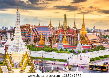 Bangkok, Thailand at the Temple of the Emerald Buddha and Grand Palace at dusk.